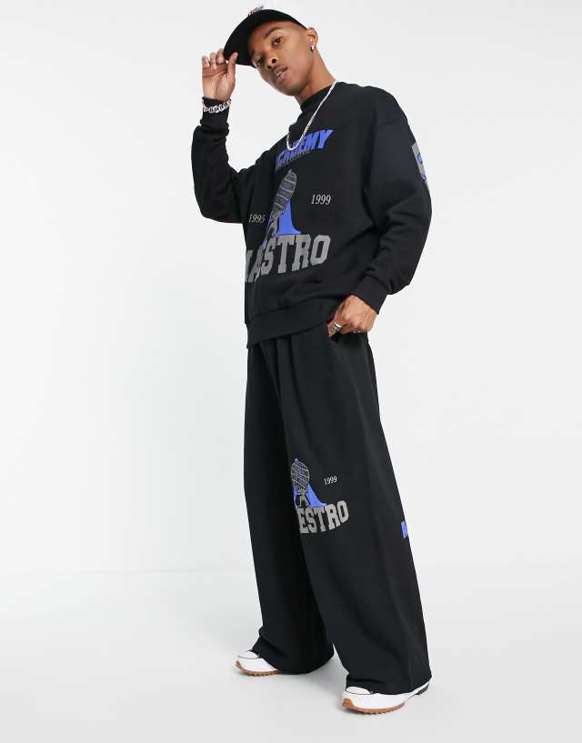 ASOS DESIGN wide leg sweatpants in black with vintage sports prints - part of a set
