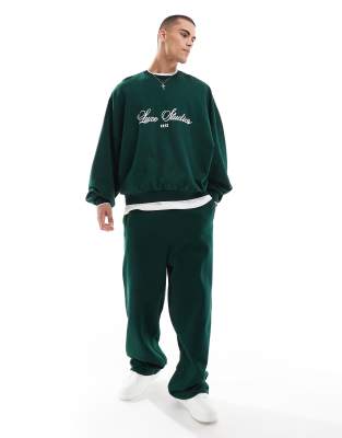 wide leg sweatpants with contrast side tape in dark green