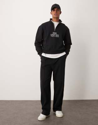 wide leg sweatpants with pin tucks and zip fastening in black