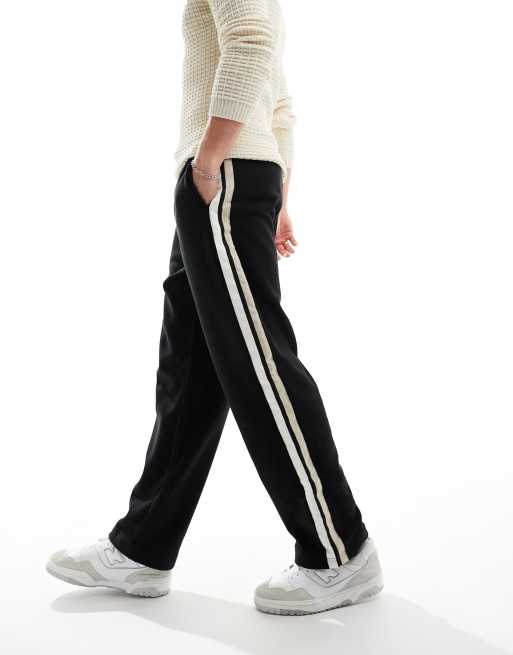 ASOS DESIGN wide leg trackies in black polar fleece with side stripe
