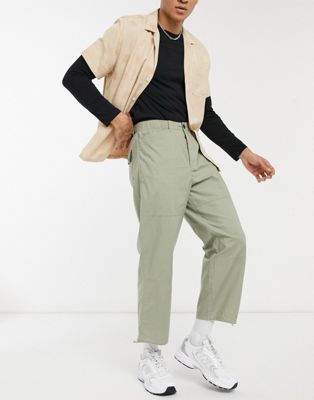 ASOS DESIGN wide leg trousers in khaki with toggle hem