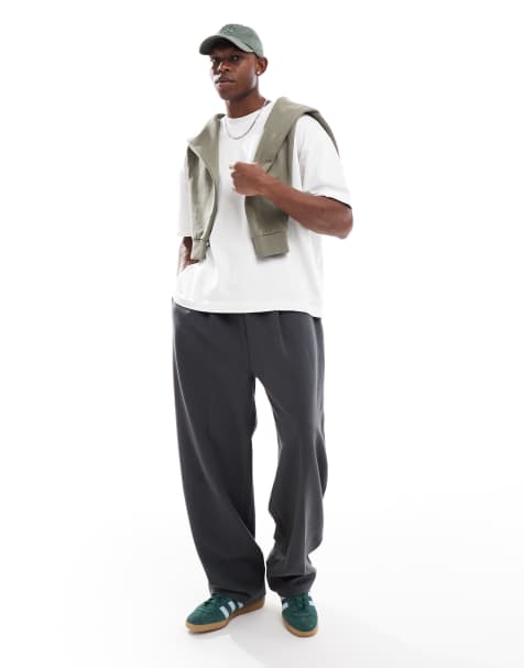 ASOS DESIGN wide leg twill jersey sweatpants with pintucks in washed black - view 1
