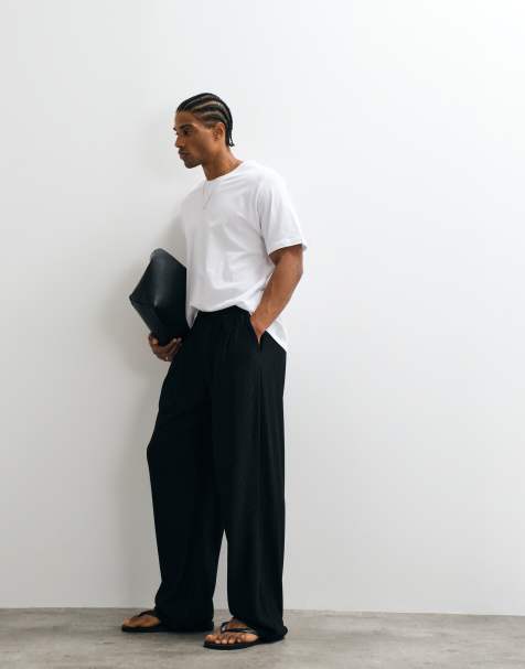 ASOS DESIGN wide log pleated sweatpants in black - view 1