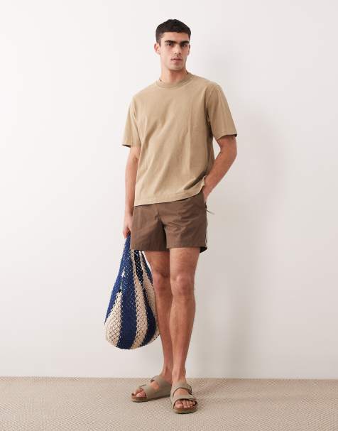 ASOS DESIGN wide mid length elasticated nylon short with piping styling in brown - view 1