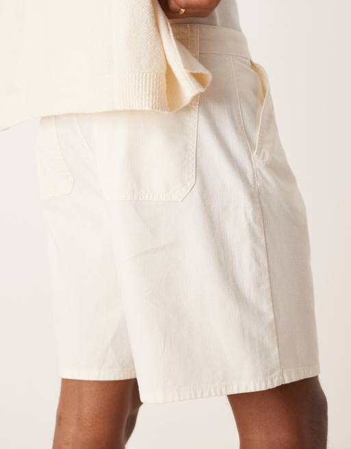 ASOS DESIGN wide mid length pleated shorts with drawstring in white