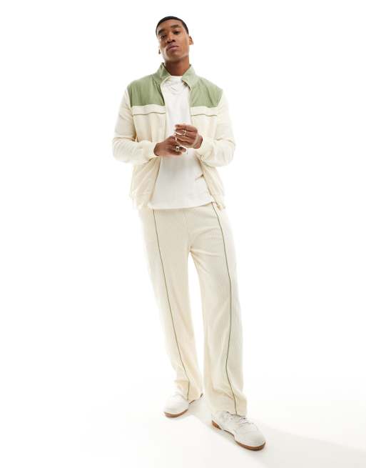 ASOS DESIGN wide ribbed velour trackies in off white with green detail