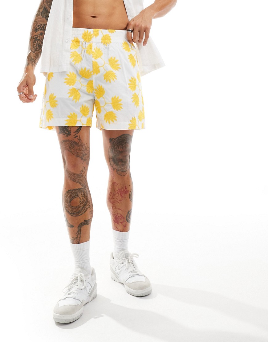 ASOS DESIGN wide short in white with yellow flower embroidery