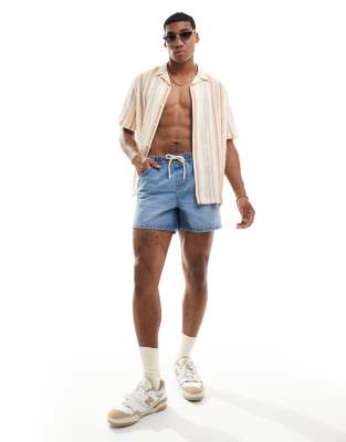 ASOS DESIGN wide shorter length denim shorts with elasticated waist in mid wash blue - view 1