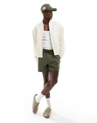 ASOS DESIGN wide shorter length linen shorts with elasticated waist in khaki