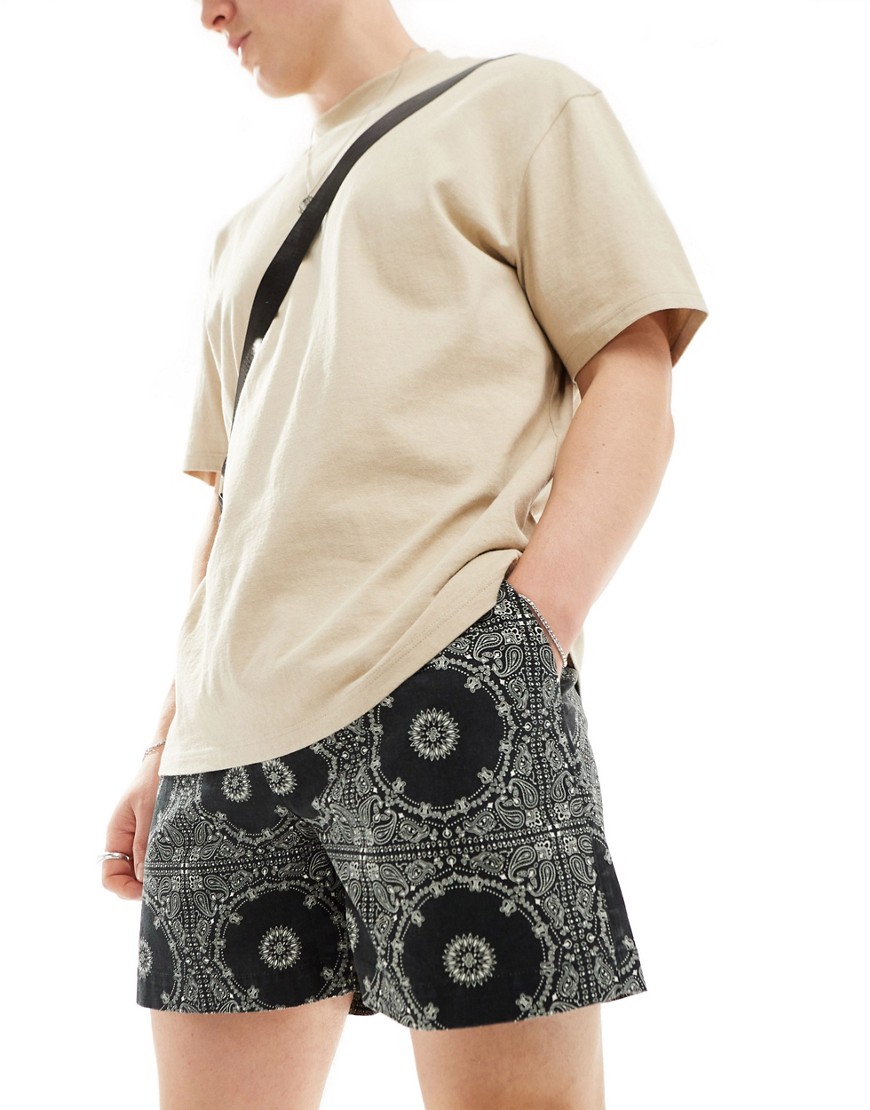 ASOS DESIGN wide shorter length short with elasticated waist in paisley print-Black