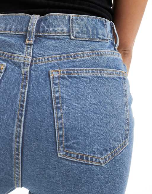 ASOS DESIGN - Wijd uitlopende jeans met halfhoge taille in middenblauw, 3 van 5