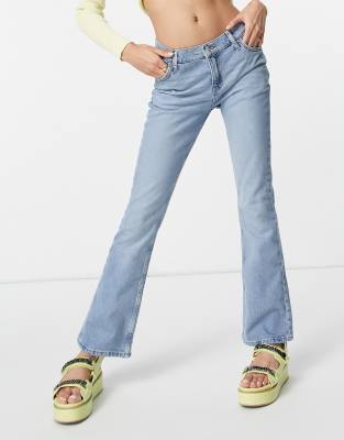 ASOS DESIGN - Wijd uitlopende jeans met stretch en lage taille in vintage  lichte wassing | ASOS
