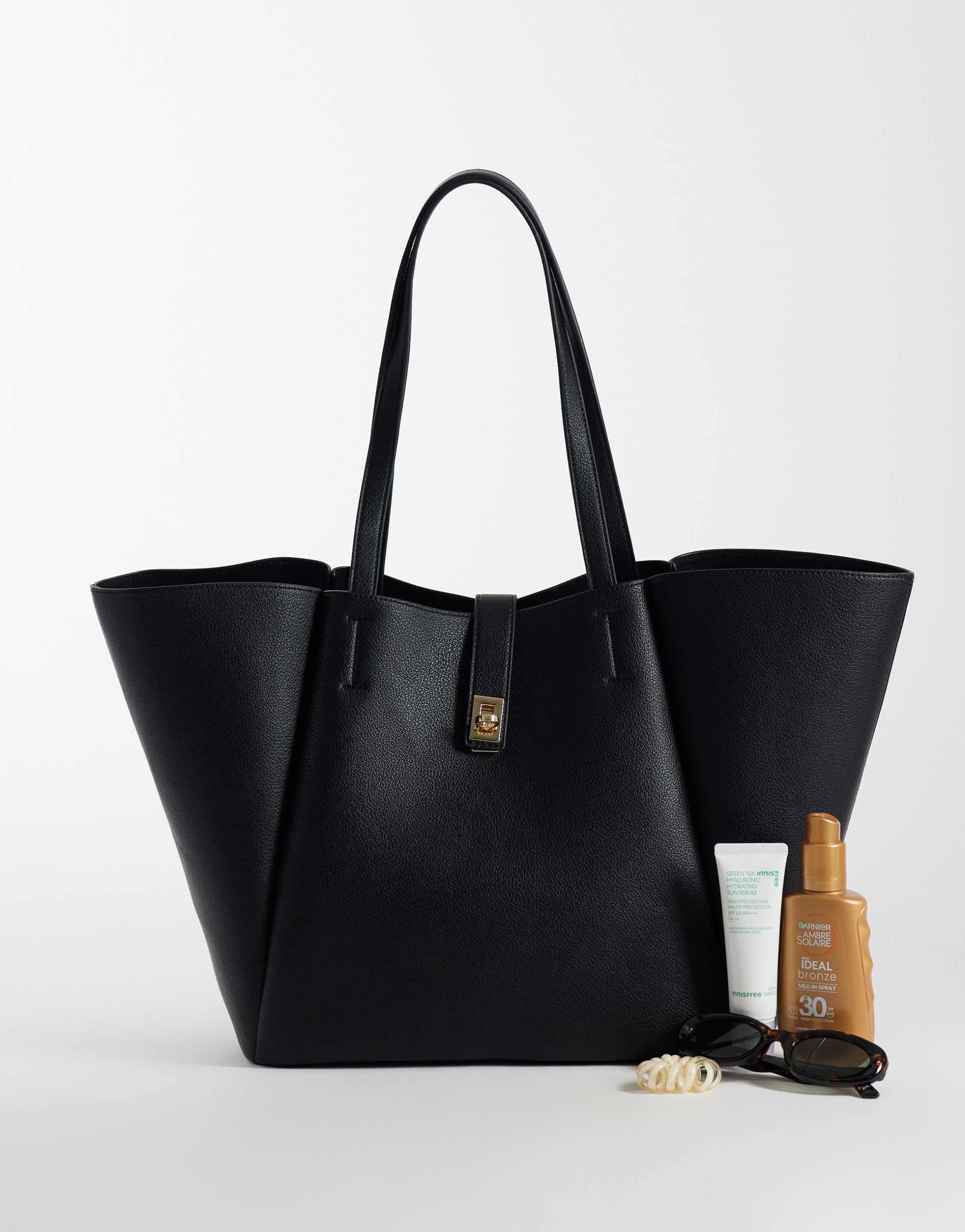asos design winged tote bag with lock detail in black