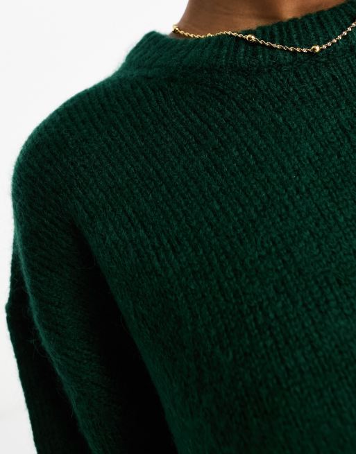 ASOS DESIGN Curve ribbed turtleneck sweater in dark green metallic