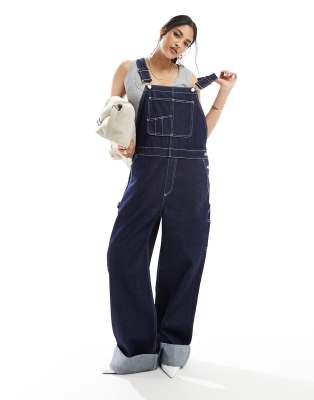 ASOS DESIGN - Workwear-Latzhose aus gewaschenem Denim-Blau