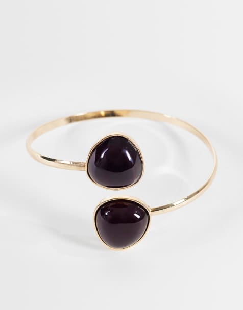 ASOS DESIGN wrap around arm cuff with burgundy resin detail in gold tone - view 1