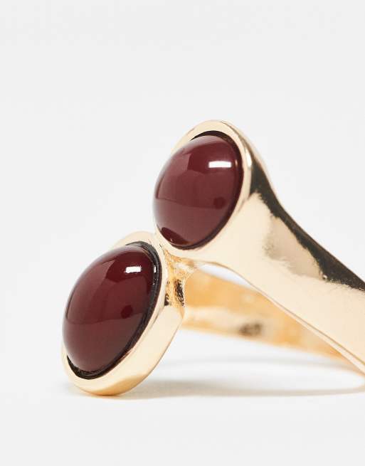 ASOS DESIGN wrap around ring with burgundy faux stones in gold tone