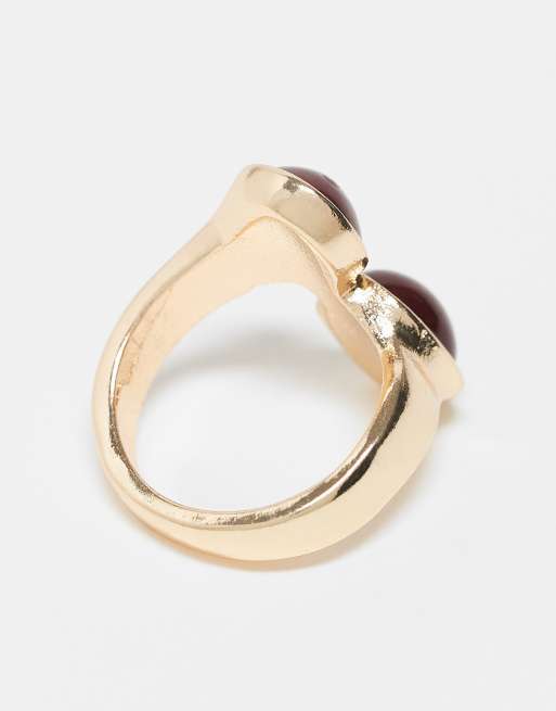 ASOS DESIGN wrap around ring with burgundy faux stones in gold tone