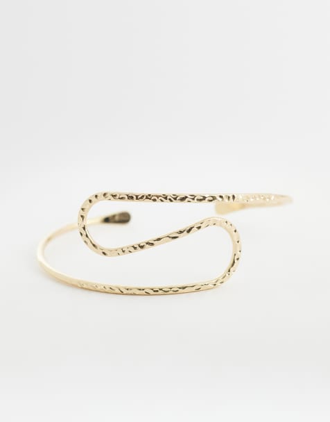 ASOS DESIGN wrap-around upper arm cuff in hammered gold tone - view 1