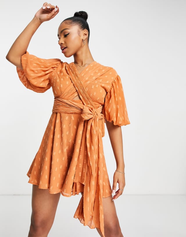 ASOS DESIGN wrap bodice flippy romper in rust