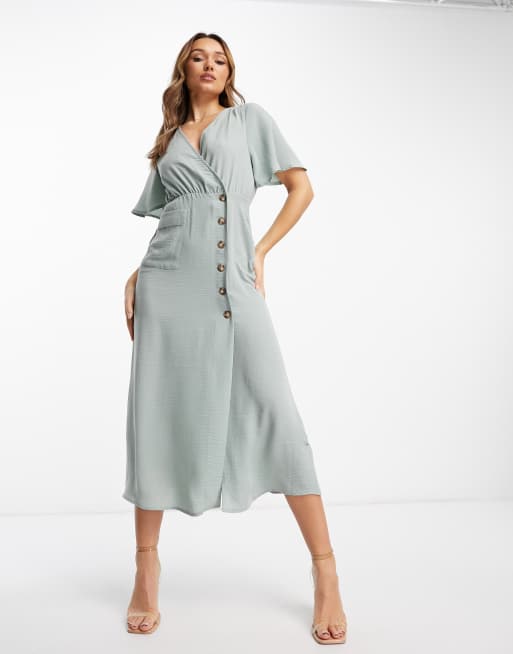 Wrap store button dress