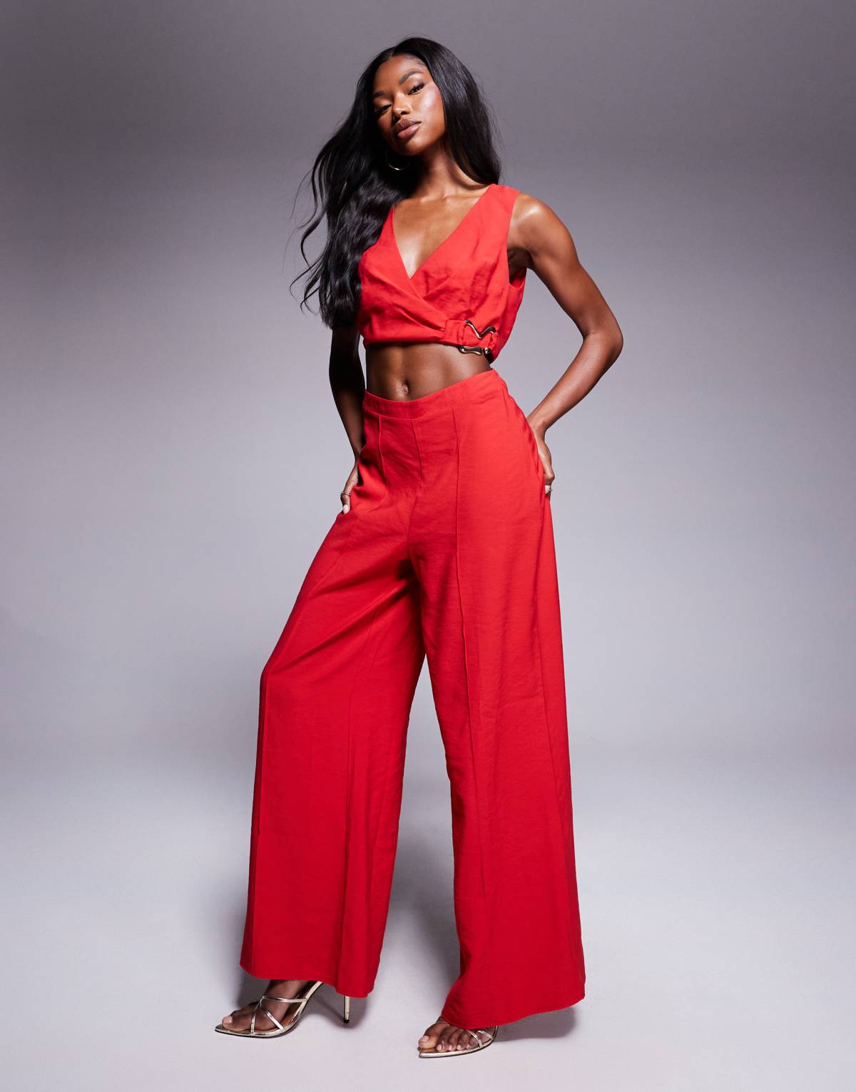 ASOS DESIGN wrap front cut out jumpsuit with buckle detail in red