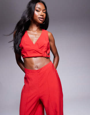 Asos Design Wrap Front Cut Out Jumpsuit With Buckle Detail In Red