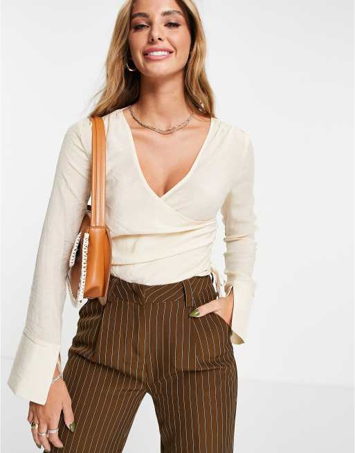 ASOS DESIGN wrap front long sleeve blouse with ruched side in cream