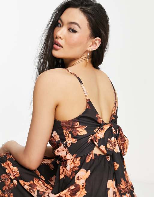 ASOS DESIGN wrap front jumpsuit with open back in bright floral print