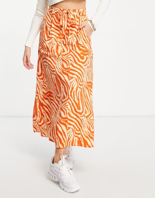 ASOS DESIGN wrap maxi skirt with pockets in orange zebra print