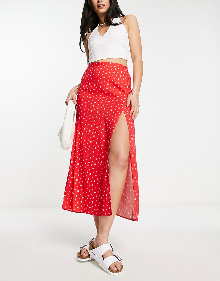 ASOS DESIGN wrap midi skirt with button detail in red ditsy floral