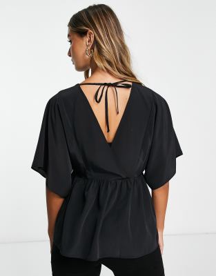 ASOS DESIGN wrap top with angel sleeve & peplum hem in black