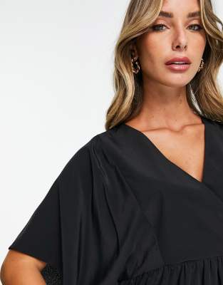 ASOS DESIGN wrap top with angel sleeve & peplum hem in black