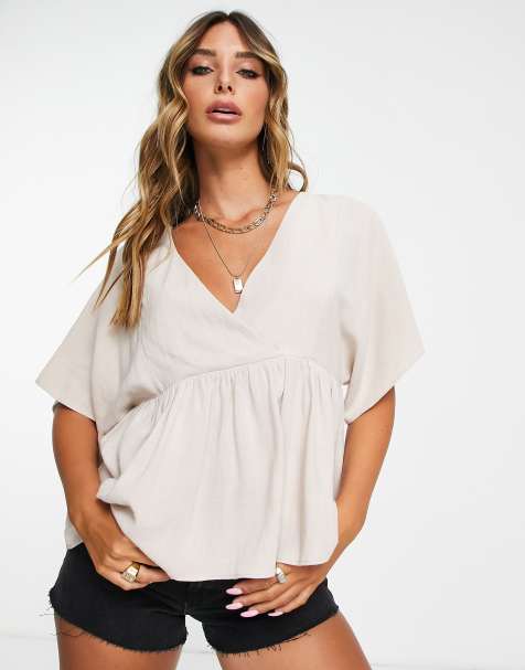 ASOS DESIGN wrap top with angel sleeve & peplum hem in natural - view 1