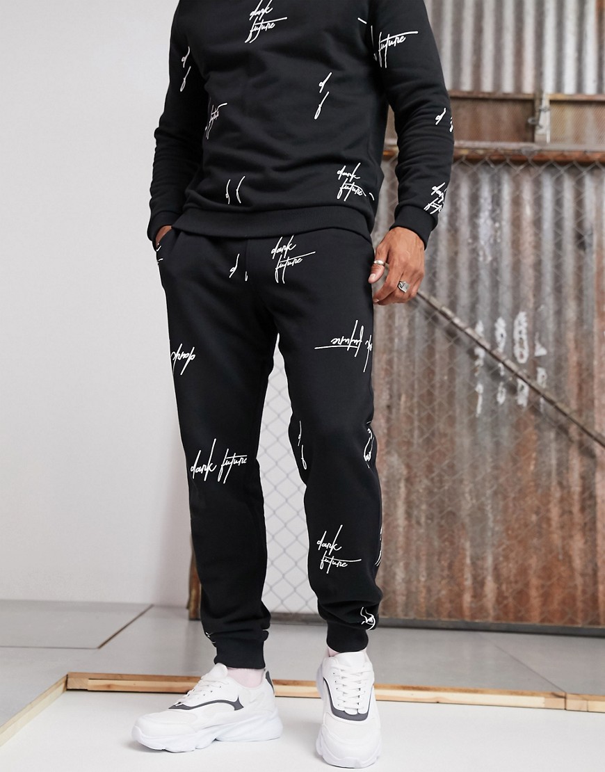 ASOS DESIGN x Dark Future co-ord tapered joggers with all over logo print in black