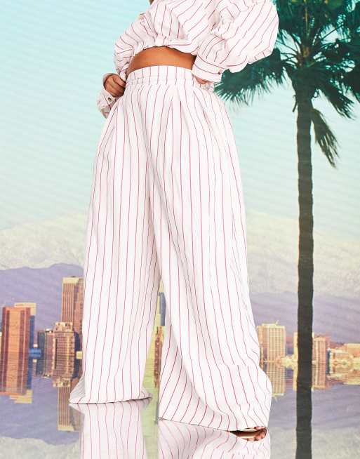 ASOS DESIGN x MILLIE Curve wide leg trouser with tie waist in pink