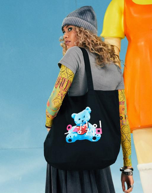 ASOS DESIGN X Squid Game The Challenge black tote bag with bear