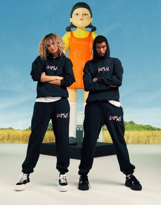 ASOS DESIGN X Squid Game: The Challenge unisex logo jogger in washed black - ASOS Price Checker