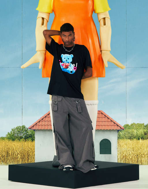 ASOS DESIGN x Squid Game: The Challenge unisex t-shirt with logo & bear in washed black, 2 of 4