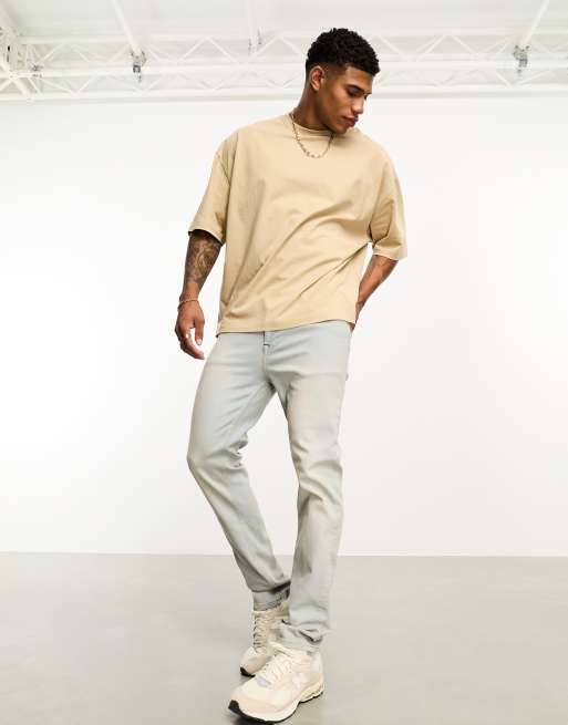ASOS DESIGN – Y2K – Eng geschnittene Jeans in verwaschenem Hellblau