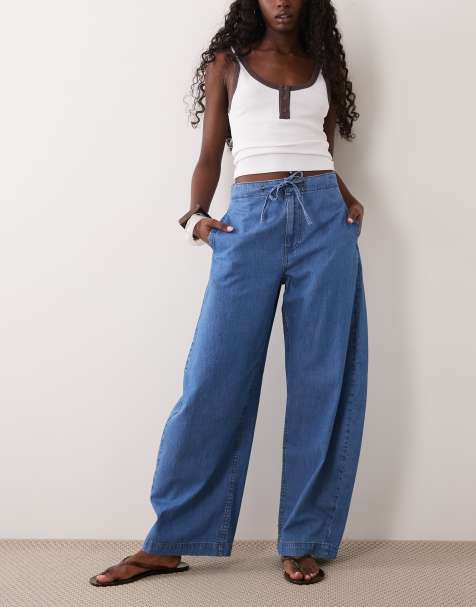 ASOS DESIGN - Zachte denim broek met elastische taille en gebogen ballonpijpen in mid-wash blauw - view 1