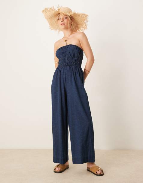 ASOS DESIGN - Zachte strapless denim jumpsuit met wijde pijpen en gesmokte taille in rinsewash - view 1