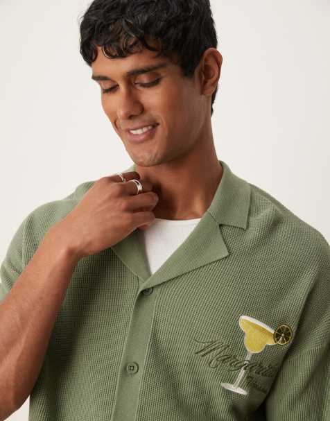 ASOS DESIGN relaxed boxy fit knitted button through polo with margarita embroidery in sage green