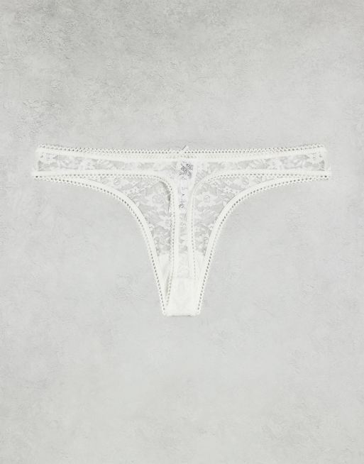 ASOS DESIGN – Zestaw 3 par koronkowych stringów w kolorach czarnym, białym i beżowym, 2 z 3