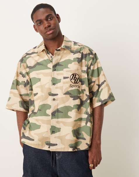 ASOS DESIGN boxy oversized shirt with chest embroidery in camo print