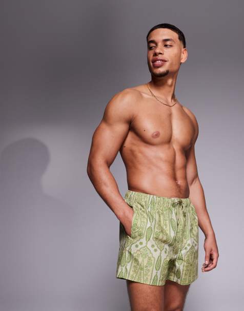 ASOS DESIGN swim shorts in short length in green paisley print