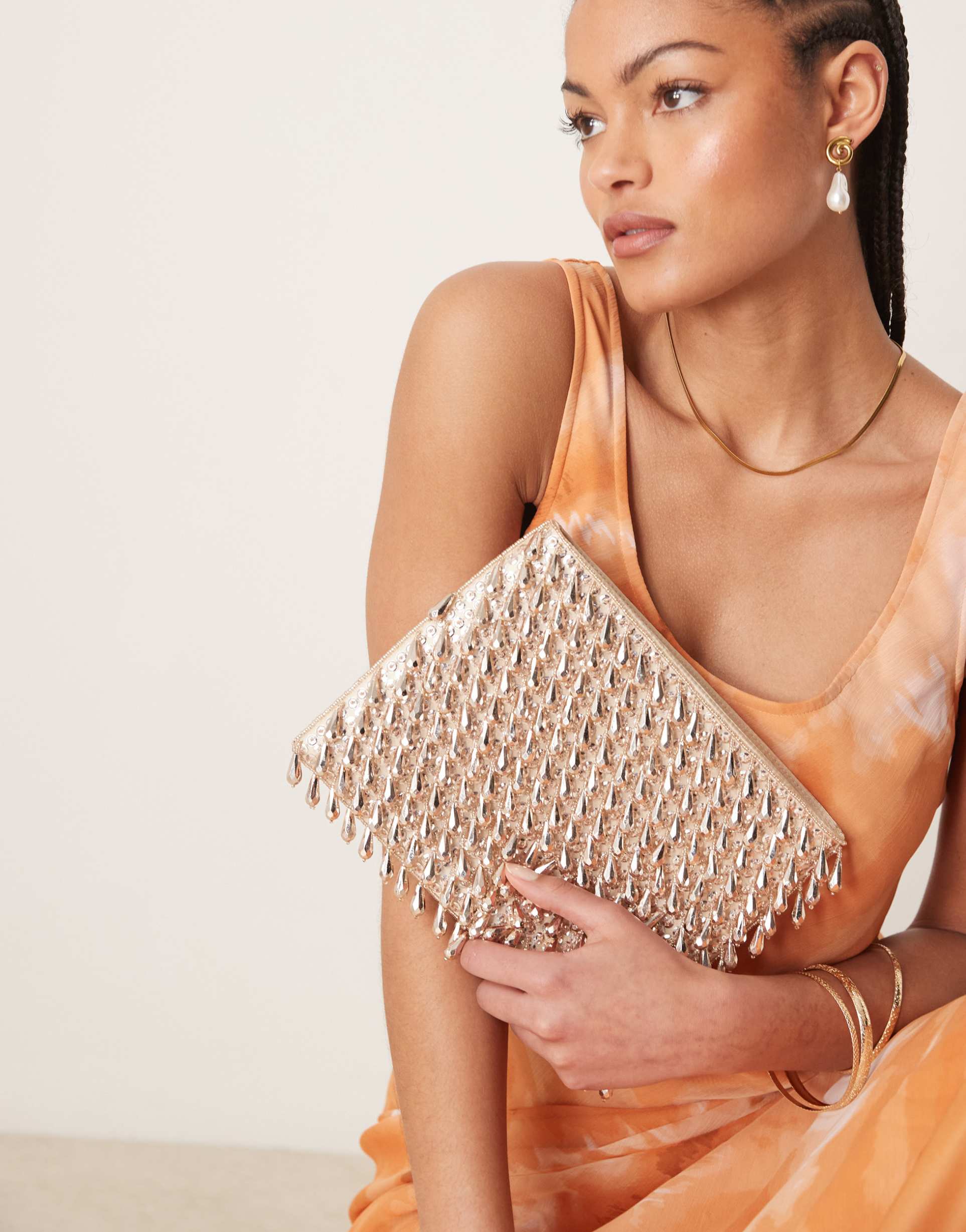 asos design zip top clutch bag in all over beads in rose gold