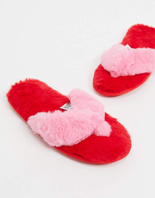 ASOS DESIGN Ziva faux fur flip flop slippers in red and pink