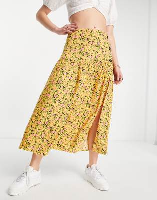 ASOS DESIGN – Żółta spódnica midi z guzikami po boku w drobny kwiatowy wzór