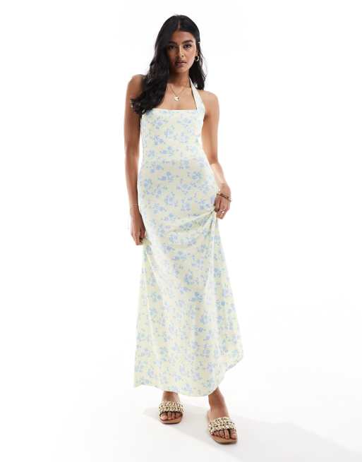 ASOS DESIGN – Żółta sukienka midi z dekoltem halter i pełną spódnicą w drobny kwiatowy wzór